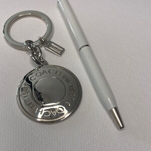 Coach Silver Keychain with a White  Coach Pen